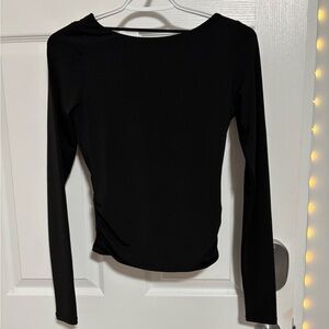 black open-back longsleeve top